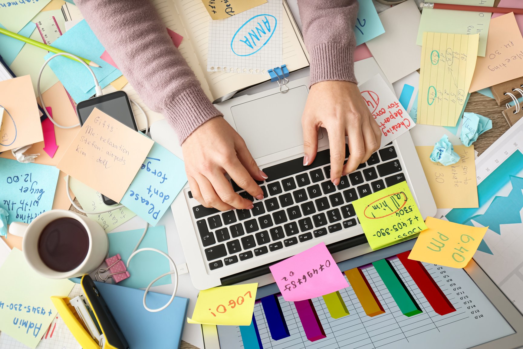 Overwhelmed Woman Working at Messy Office Desk, Top View